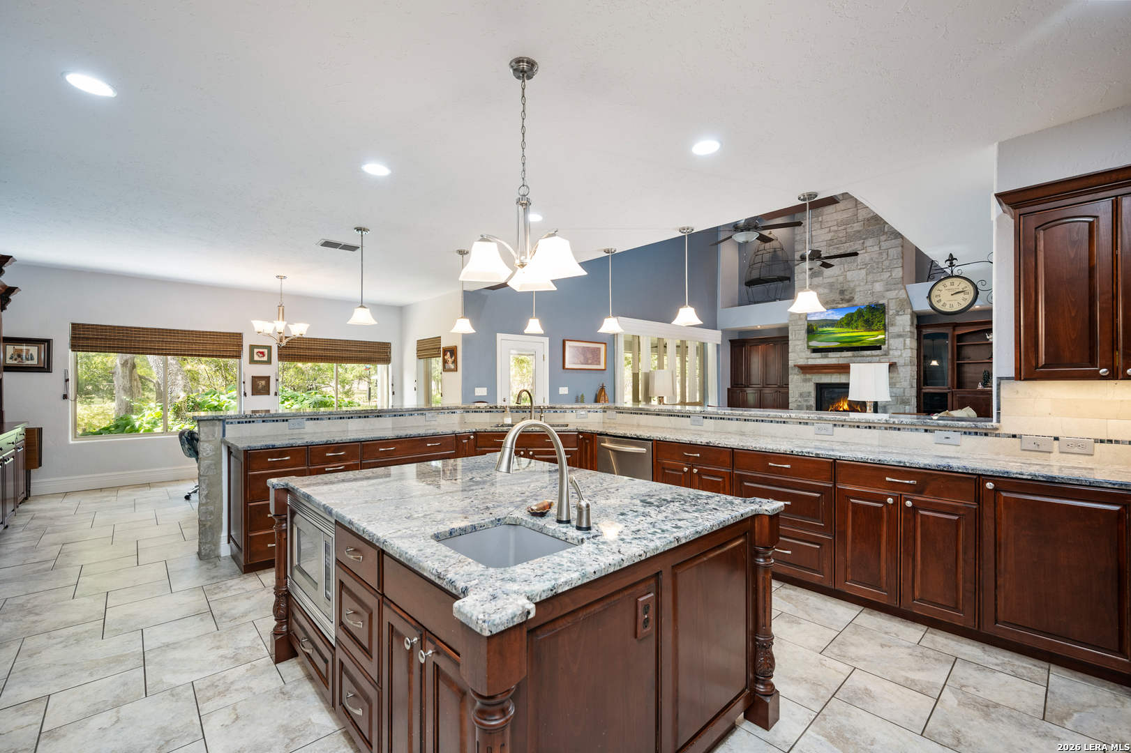 613 Saxet Trail Spring Branch, TX 78070 - Photo 13 of 50 a kitchen with a stove a counter space and a sink