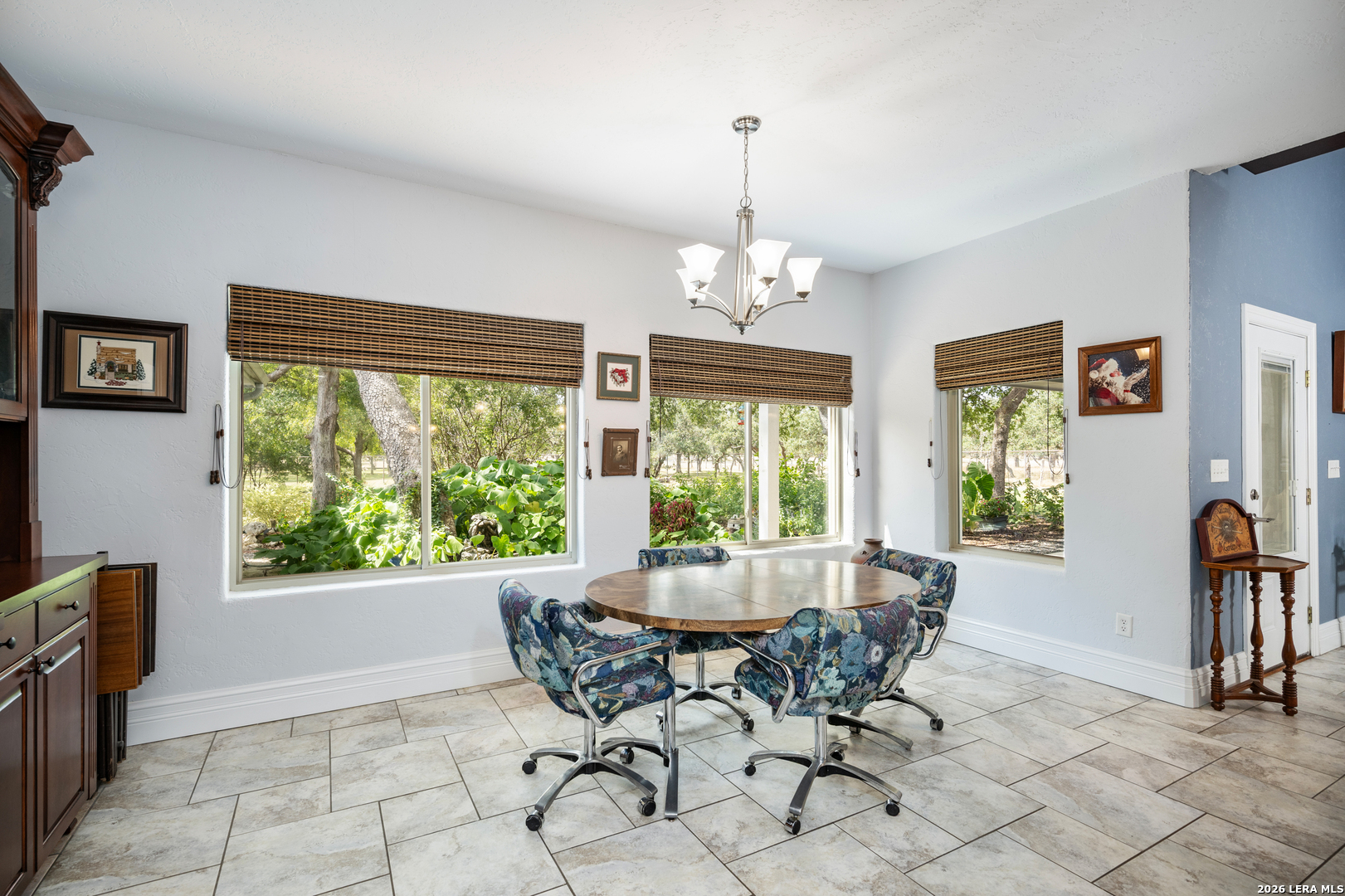 613 Saxet Trail Spring Branch, TX 78070 - Photo 16 of 50 a view of a dining room with furniture window and outside view