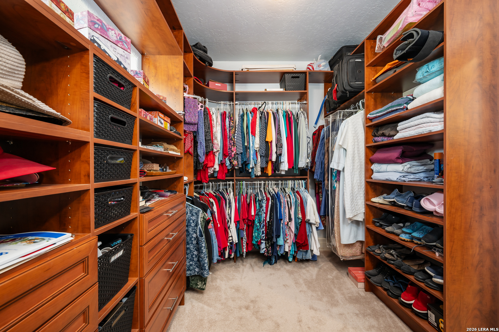 613 Saxet Trail Spring Branch, TX 78070 - Photo 26 of 50 a view of walk in closet with clothes and shoes