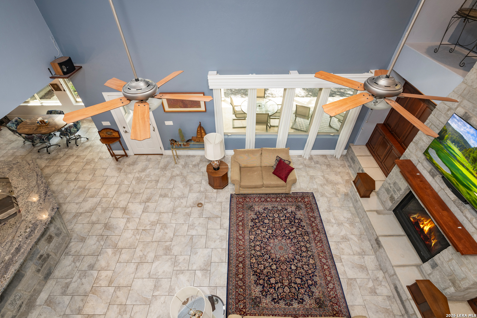 613 Saxet Trail Spring Branch, TX 78070 - Photo 30 of 50 a living room with furniture and a floor to ceiling window