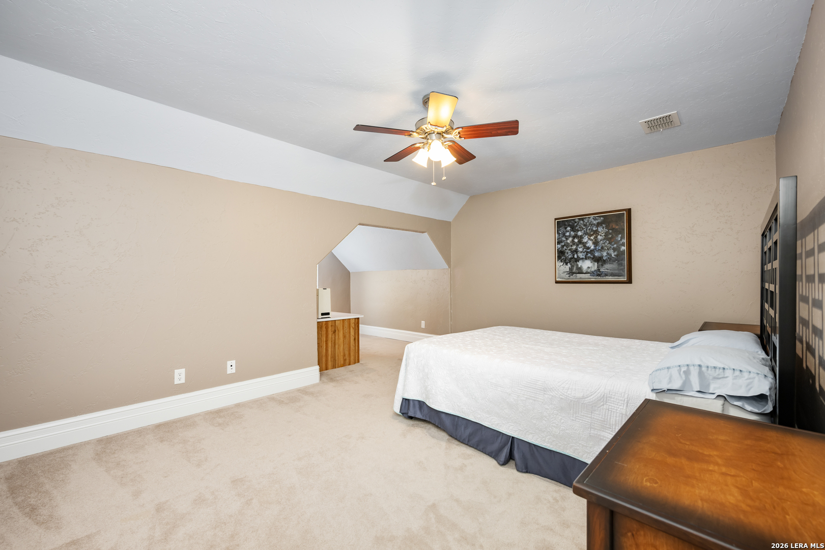 613 Saxet Trail Spring Branch, TX 78070 - Photo 39 of 50 a bedroom with a bed and a lamp on dresser