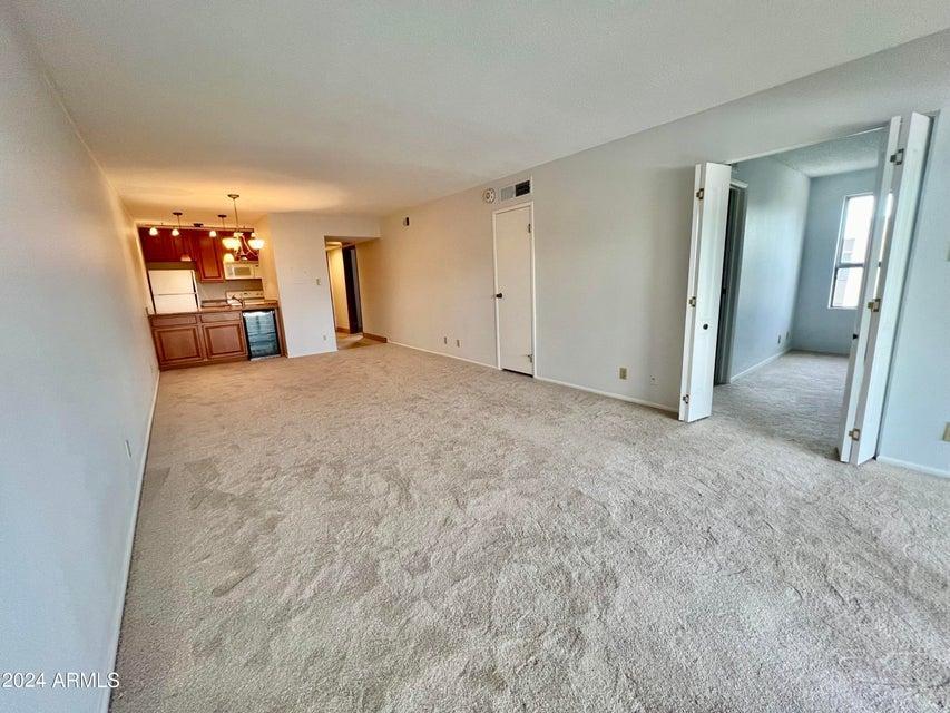 7625 East Camelback Road, Unit 415A Scottsdale, AZ 85251 - Photo 11 of 17 a view of a big room with closet and cabinet