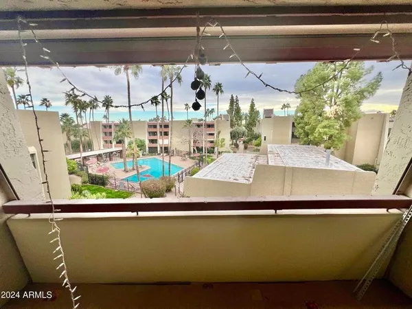 a view of room with window and front door