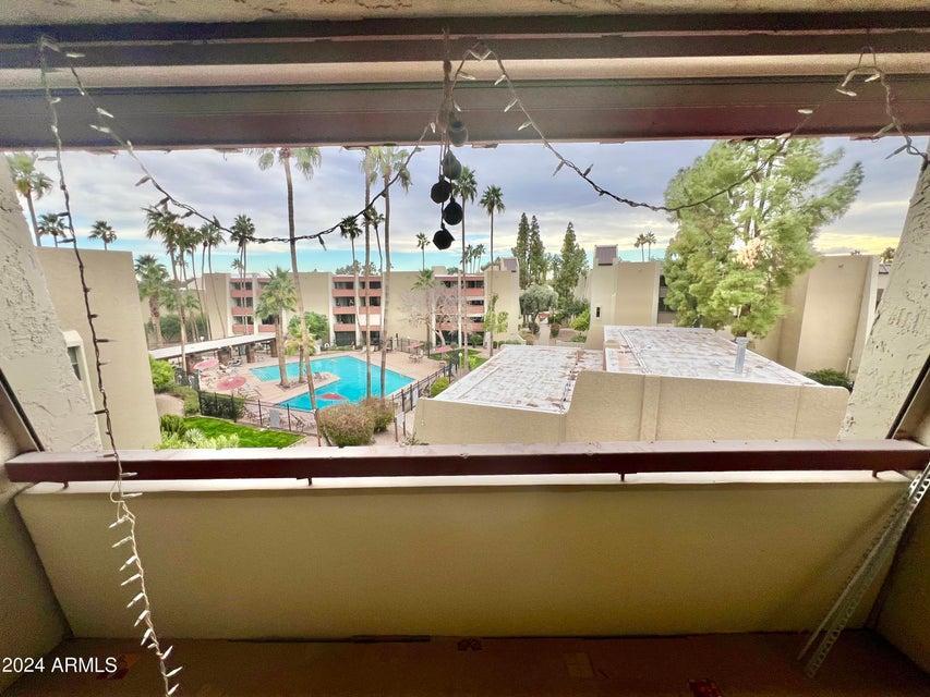 7625 East Camelback Road, Unit 415A Scottsdale, AZ 85251 - Photo 15 of 17 a room with table and chairs
