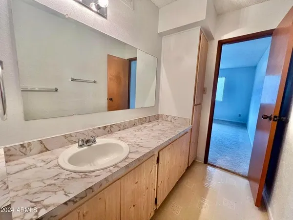 a kitchen with a sink a refrigerator and window