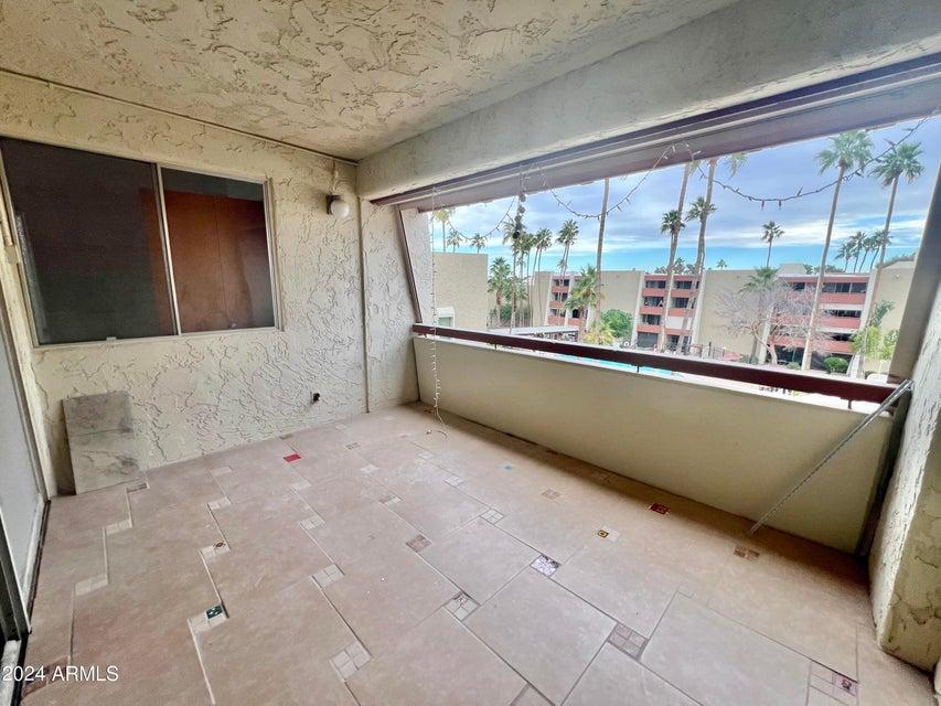 7625 East Camelback Road, Unit 415A Scottsdale, AZ 85251 - Photo 8 of 17 a view of a kitchen with large windows