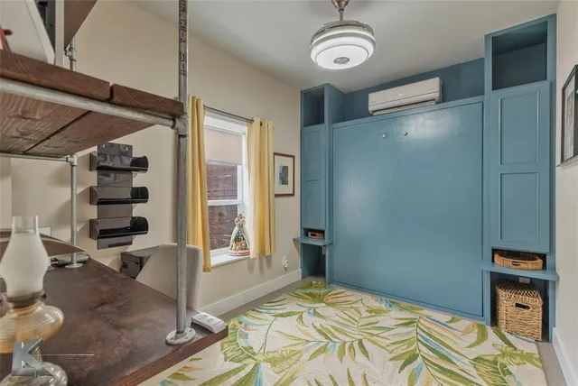 a bedroom with a large bed and a large window