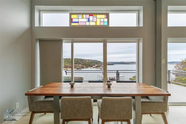 a kitchen with stainless steel appliances granite countertop a sink a stove and cabinets