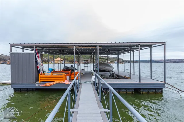 a outdoor space with the couches and dining table with the garden view