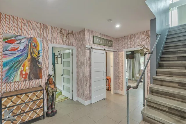 a view of an empty room with stairs