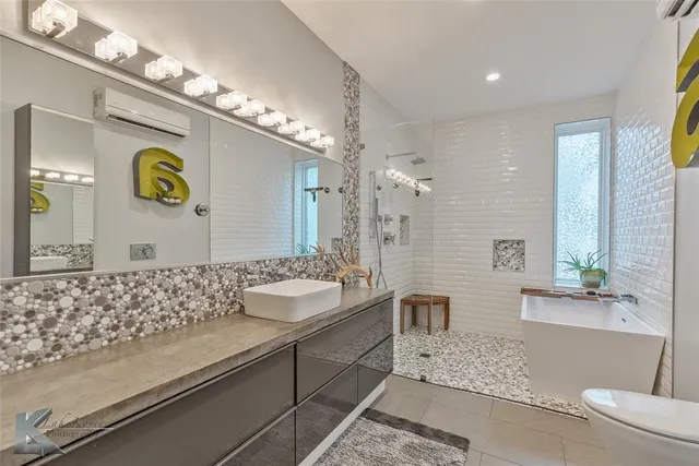 a bathroom with a bathtub and a shower