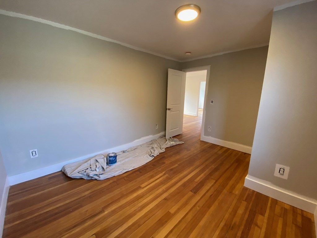 23 Main Street, Unit 2 Topsfield, MA 01983 - Photo 12 of 16 a view of a room with wooden floor