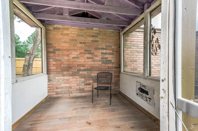 a view of a backyard with sitting area