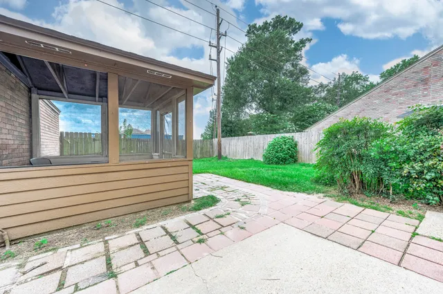 a backyard of a house with lots of green space