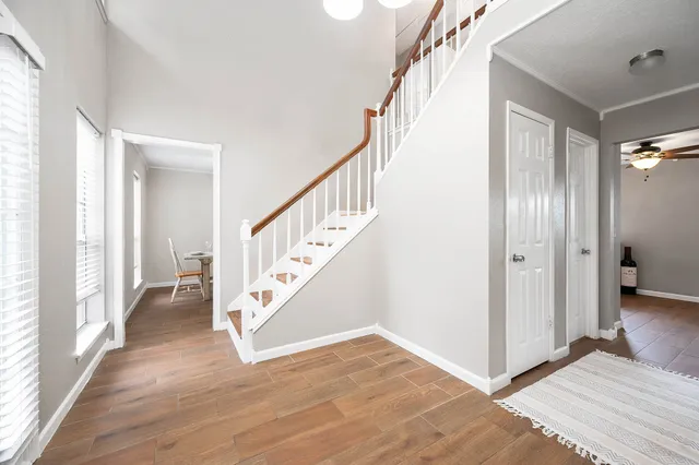 a view of an entryway with wooden floor