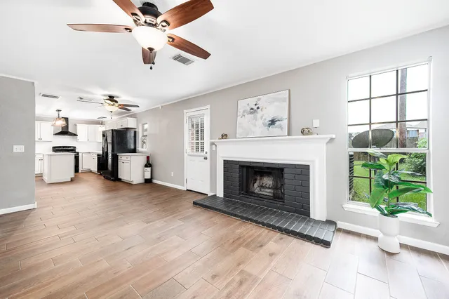 a living room with furniture and a fireplace