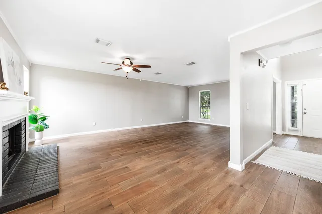a view of livingroom with hardwood floor and a ceiling fan