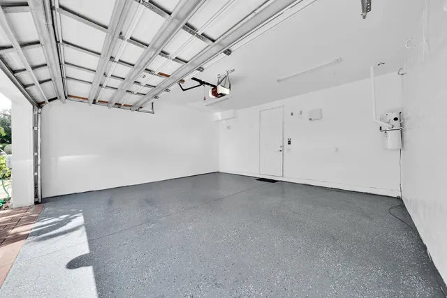 a view of a house with a yard and garage