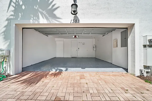a kitchen with stainless steel appliances a stove and white cabinets