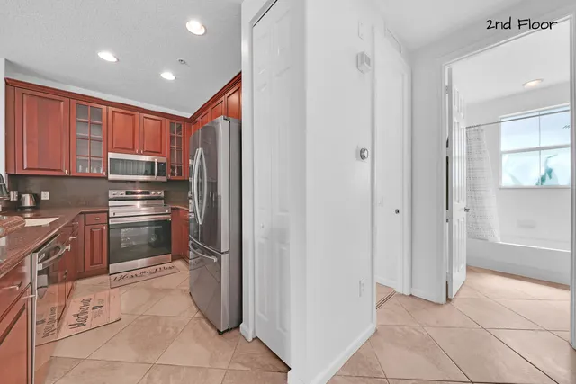 a en suite bathroom with a tub shower and window