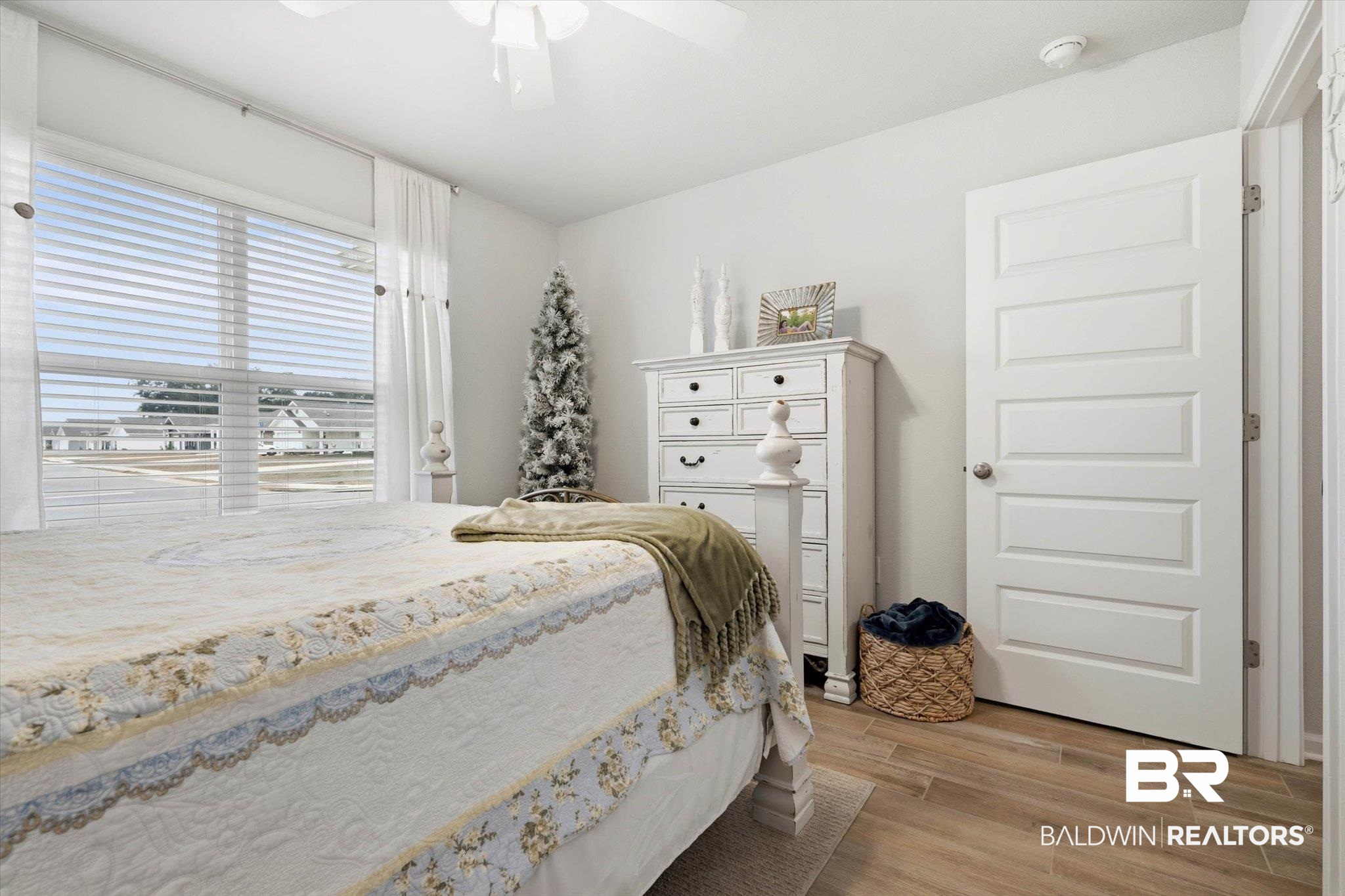 17041 Muse Street Loxley, AL 36551 - Photo 22 of 44 Bedroom with light wood-type flooring and a ceiling fan