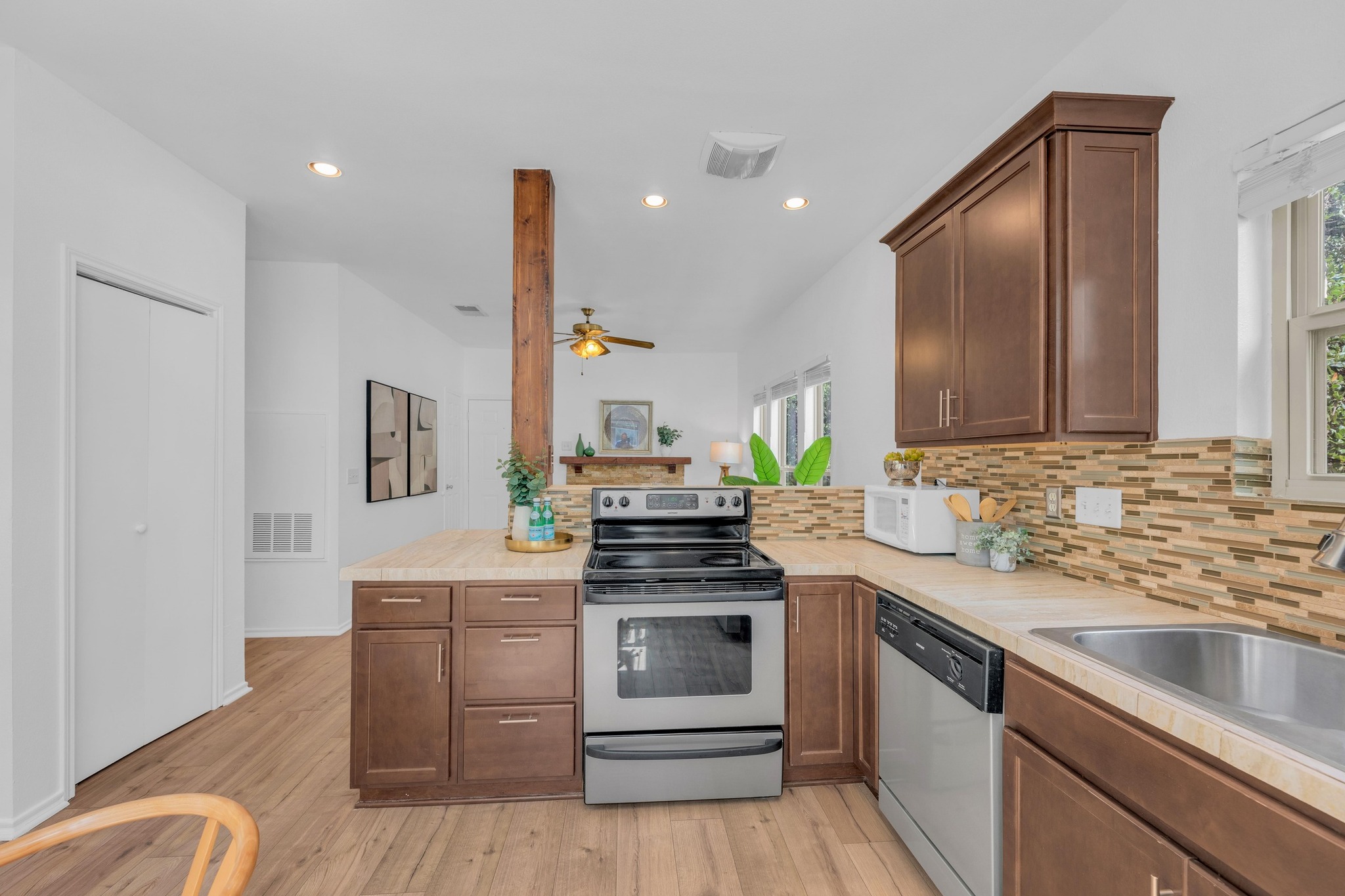 2414 Longview Street, Unit 101 Austin, TX 78705 - Photo 11 of 31 a kitchen with a sink stove and cabinets