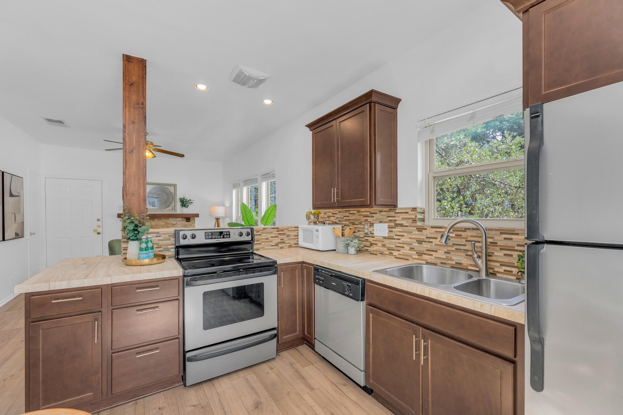 2414 Longview Street, Unit 101 Austin, TX 78705 - Photo 12 of 31 a kitchen with a sink stove and microwave
