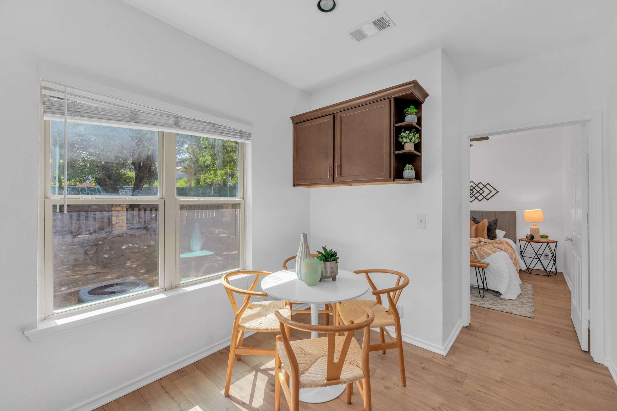 2414 Longview Street, Unit 101 Austin, TX 78705 - Photo 13 of 31 a dining room with furniture and window