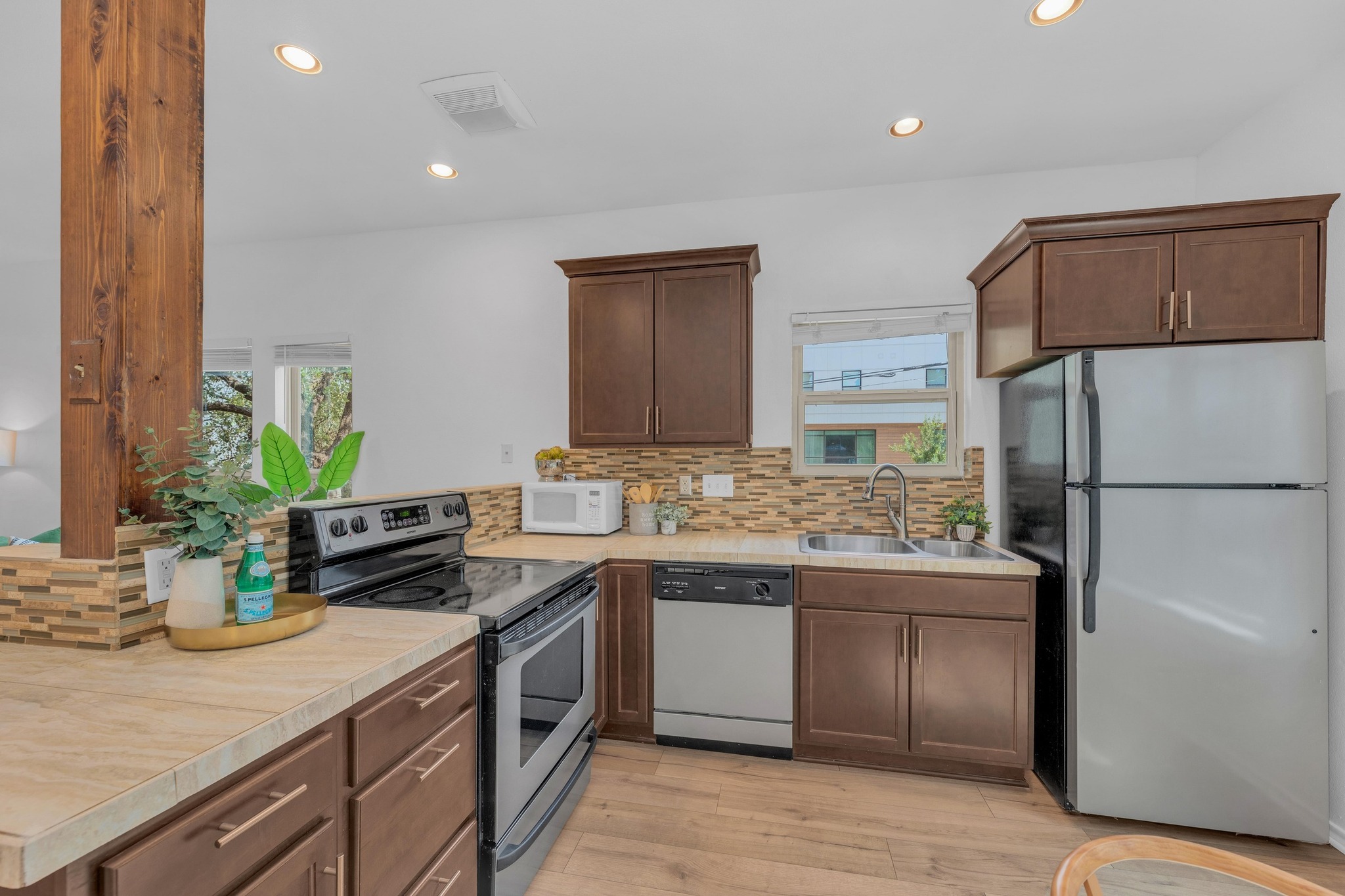 2414 Longview Street, Unit 101 Austin, TX 78705 - Photo 14 of 31 a kitchen with a sink and refrigerator