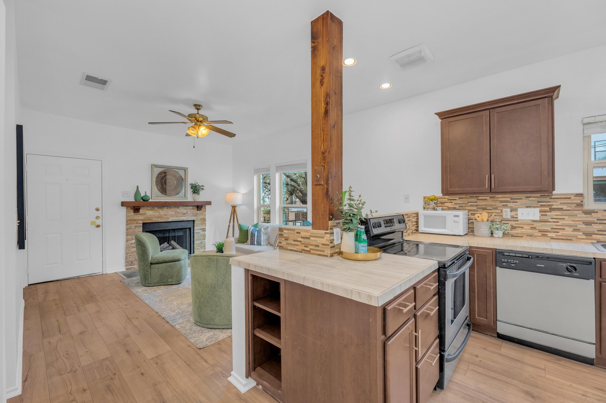 2414 Longview Street, Unit 101 Austin, TX 78705 - Photo 15 of 31 a kitchen that has a sink a stove and a table