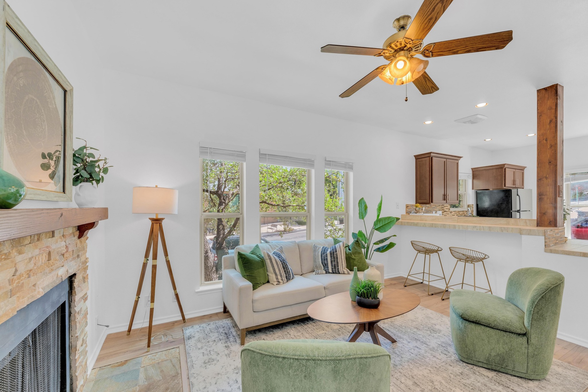 2414 Longview Street, Unit 101 Austin, TX 78705 - Photo 2 of 31 a living room with furniture a rug and a chandelier