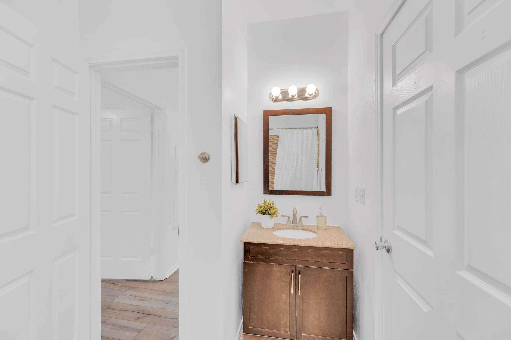 2414 Longview Street, Unit 101 Austin, TX 78705 - Photo 21 of 31 a bathroom with a sink vanity and a mirror