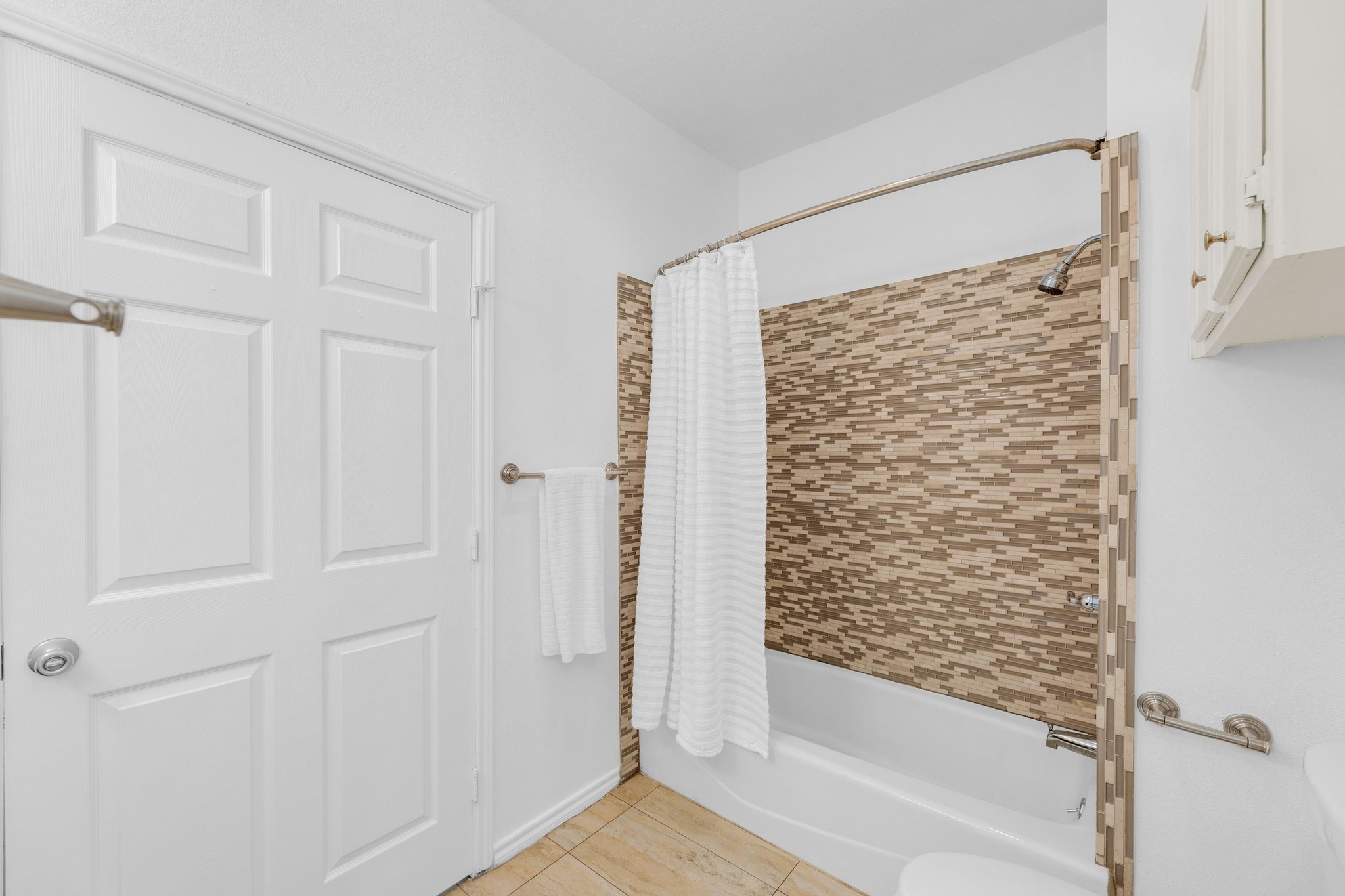 2414 Longview Street, Unit 101 Austin, TX 78705 - Photo 22 of 31 a bathroom with a bathtub and a shower