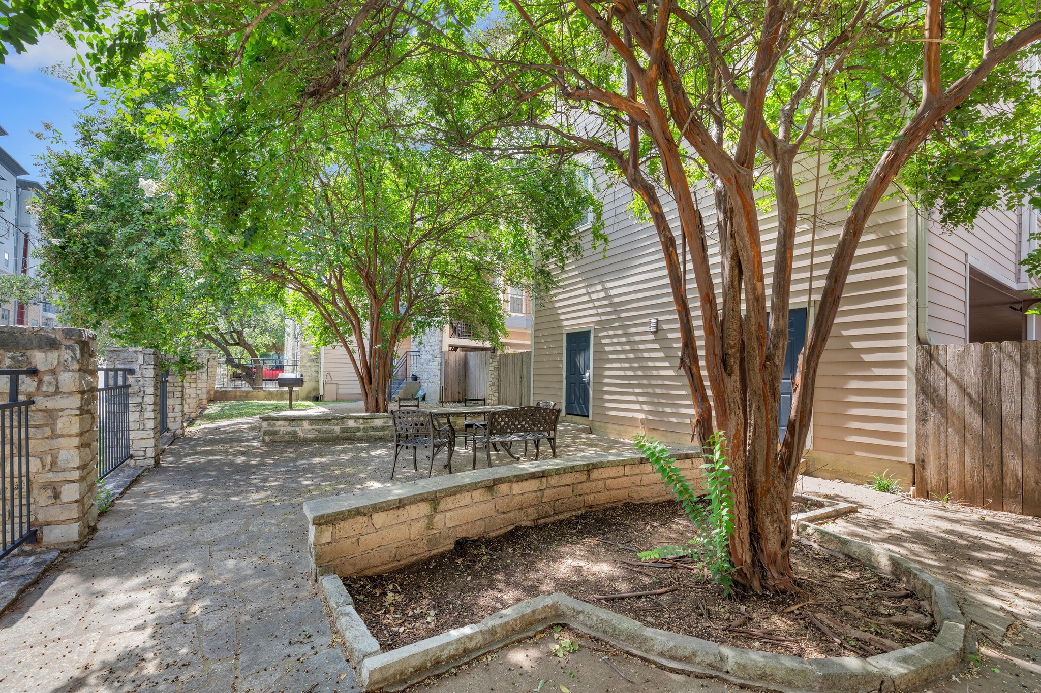 2414 Longview Street, Unit 101 Austin, TX 78705 - Photo 30 of 31 a view of a house with backyard and trees