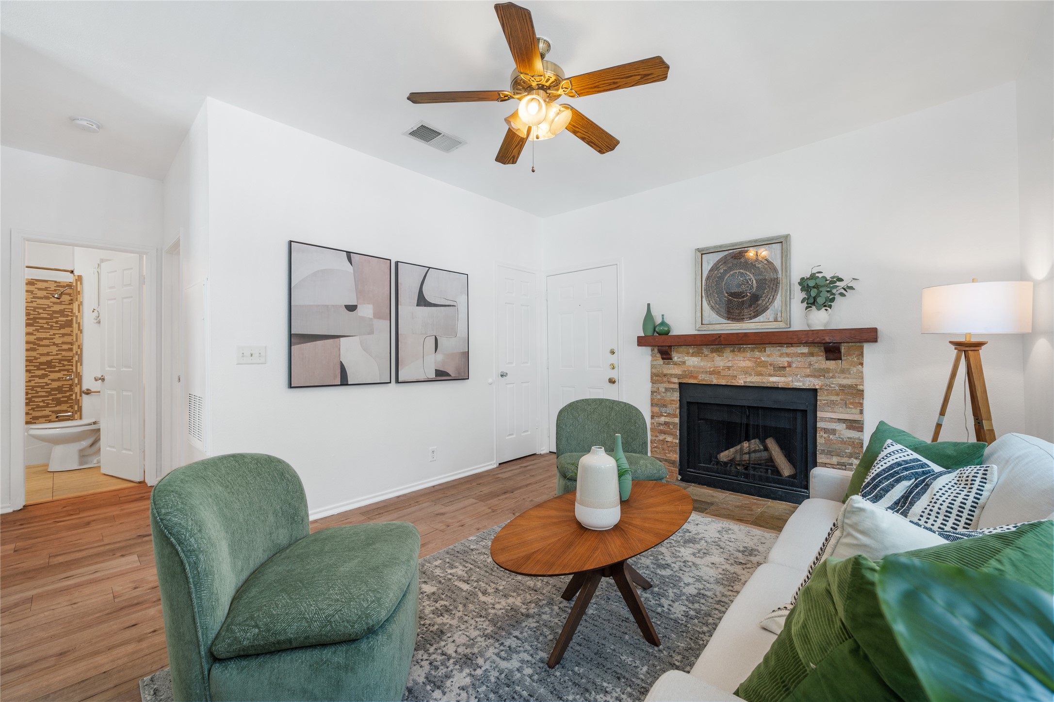 2414 Longview Street, Unit 101 Austin, TX 78705 - Photo 7 of 31 a living room with furniture and a fireplace