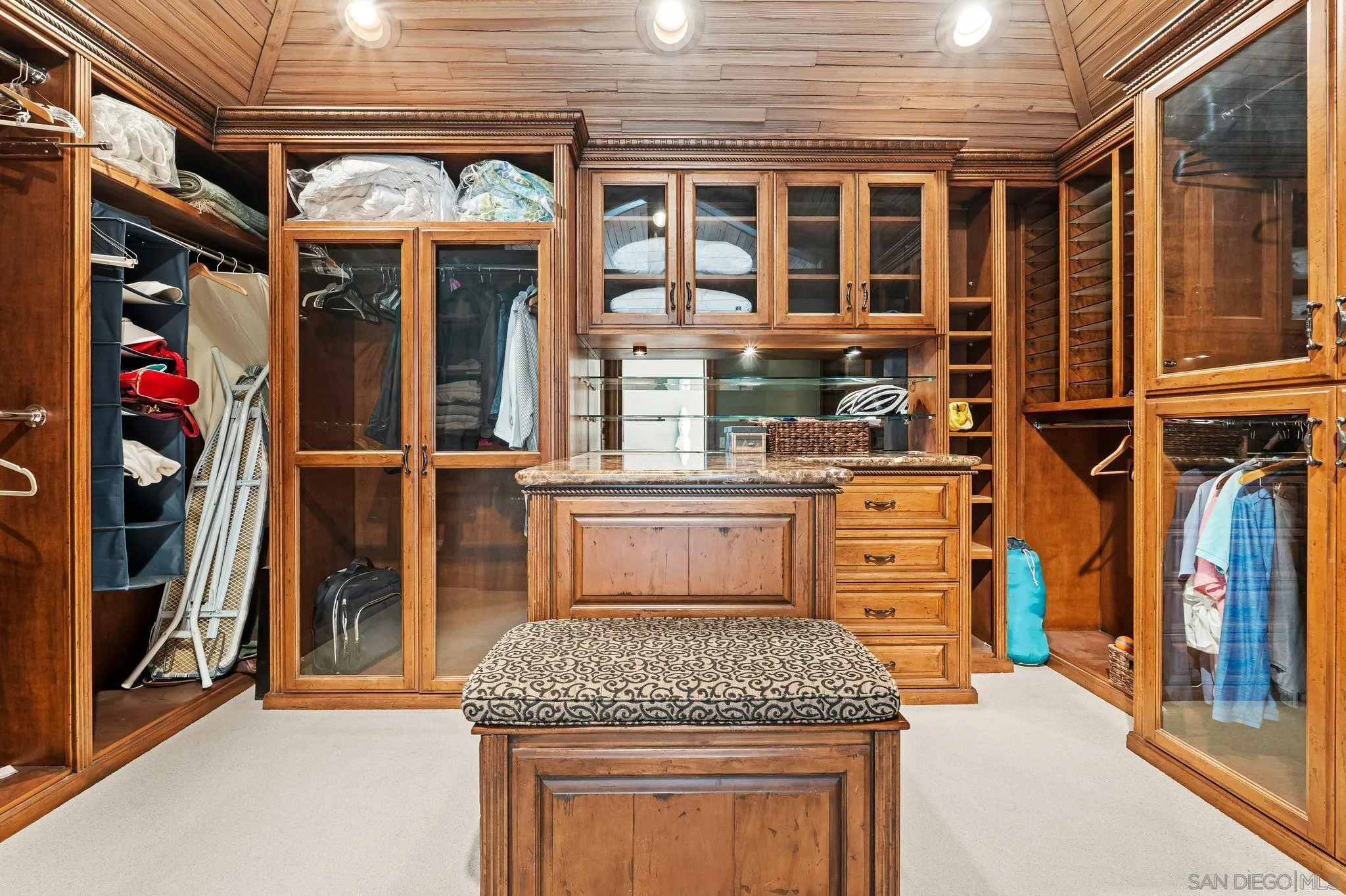 2969 Racetrack View Drive Del Mar, CA 92014 - Photo 31 of 59 a kitchen that has a lot of cabinets in it
