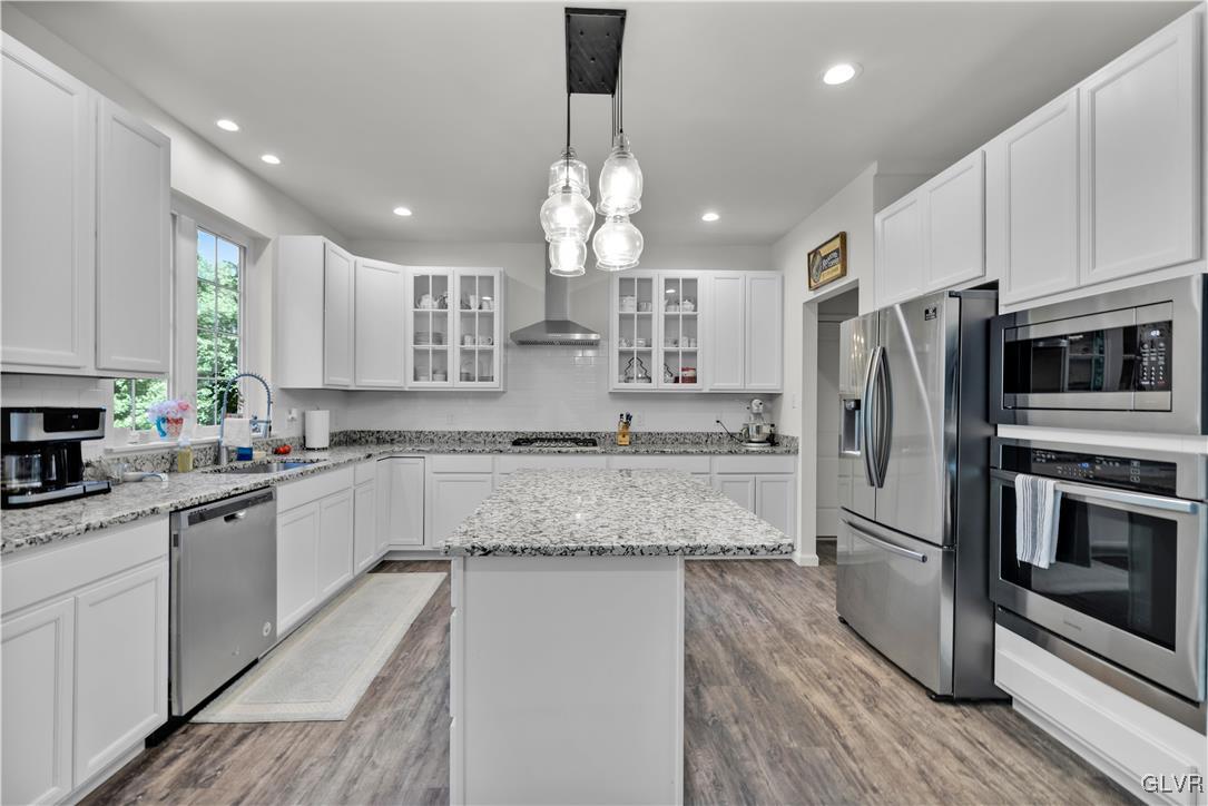 152 Corktree Road Kunkletown, PA 18058 - Photo 11 of 49 a large kitchen with granite countertop a large counter top a sink stainless steel appliances and cabinets
