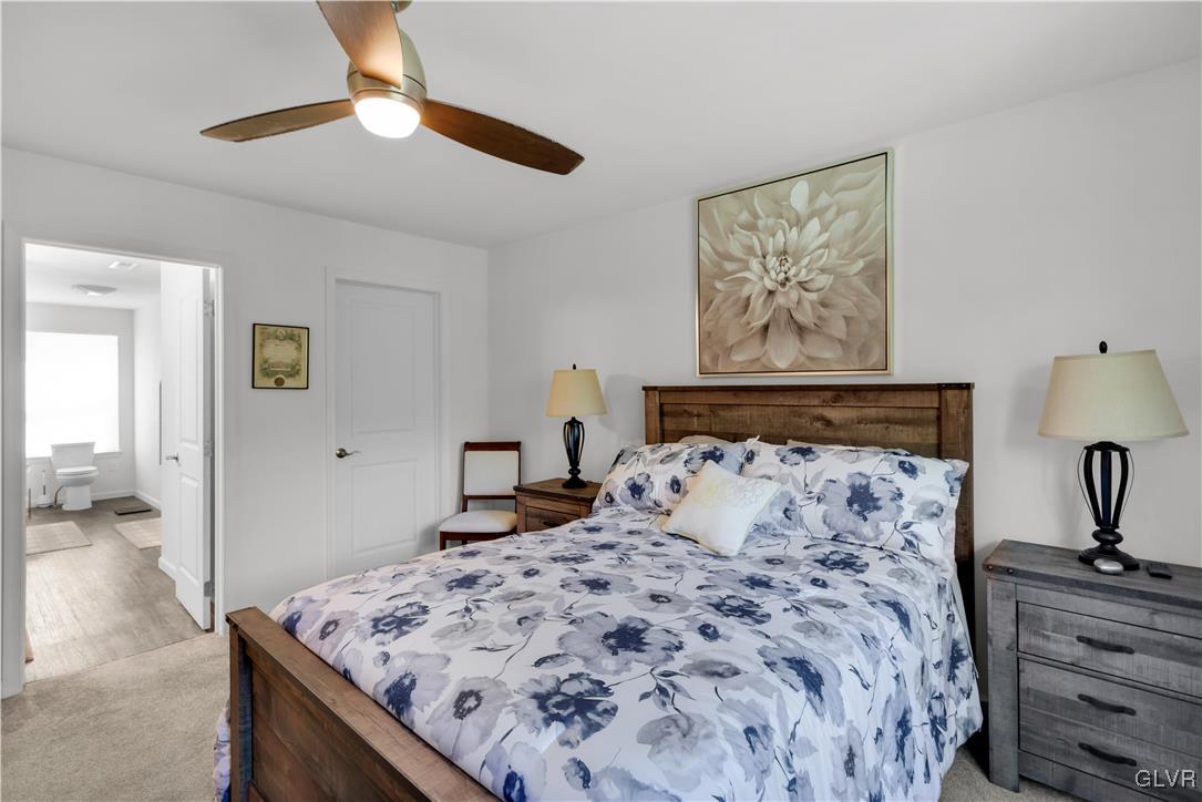 152 Corktree Road Kunkletown, PA 18058 - Photo 25 of 49 a bedroom with a bed and a chandelier