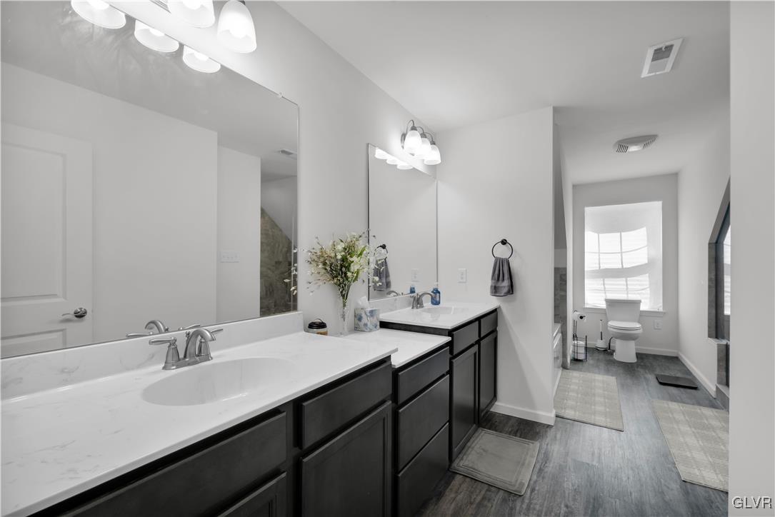 152 Corktree Road Kunkletown, PA 18058 - Photo 26 of 49 a en suite bathroom with a double vanity sink a mirror and a shower