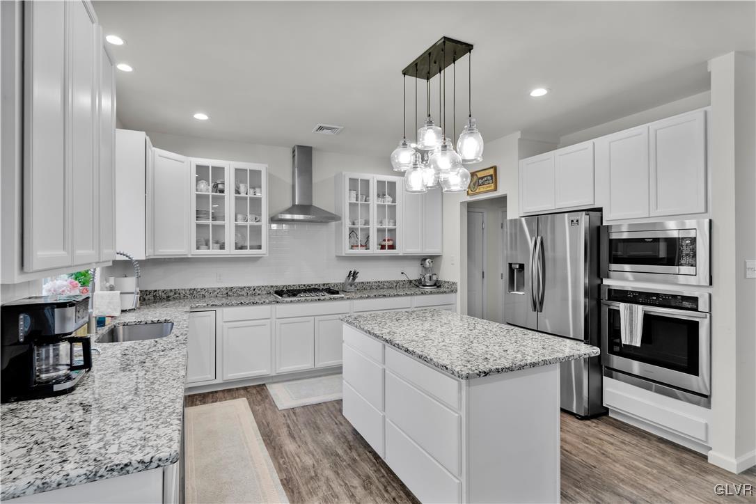 152 Corktree Road Kunkletown, PA 18058 - Photo 9 of 49 a kitchen with stainless steel appliances granite countertop a sink stove and refrigerator