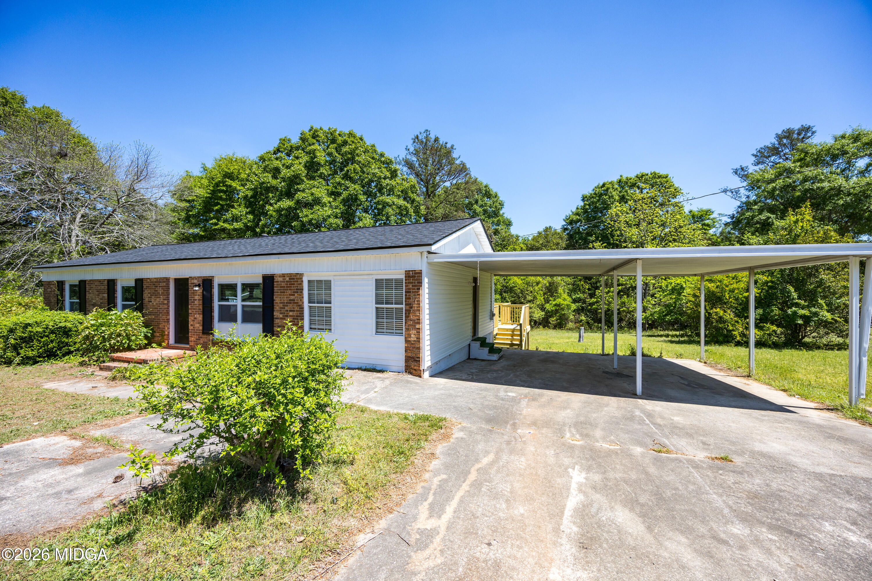 427 Gun Club Road Fort Valley, GA 31030 - Photo 2 of 26 front view of a house with a yard