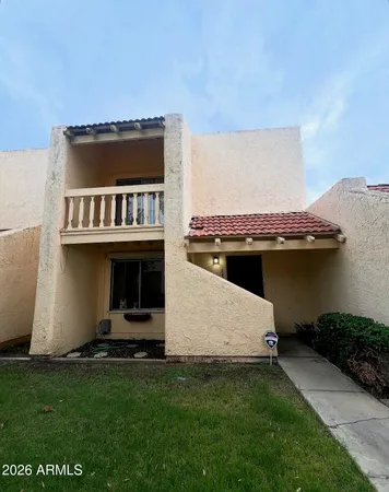 a terrace with a table and chairs