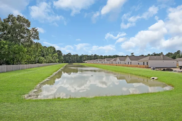 a view of a lake with a big yard