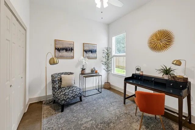 a living room with furniture and a window