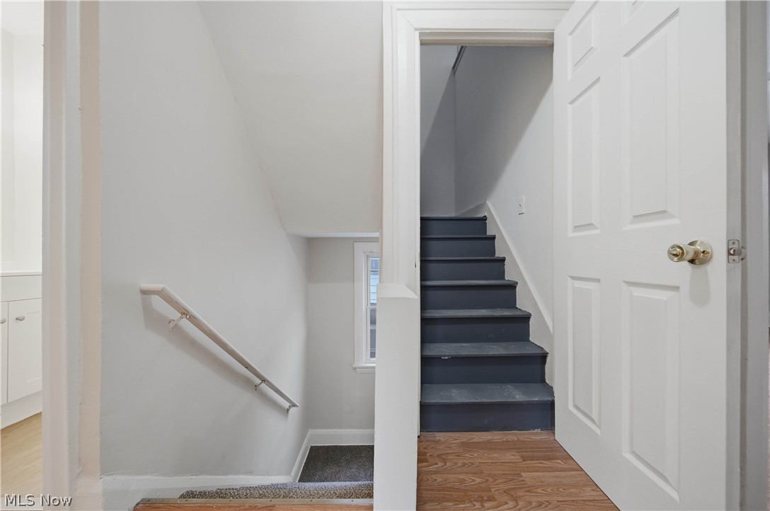 225 Cranz Place Akron, OH 44310 - Photo 19 of 34 Staircase with baseboards and wood finished floors