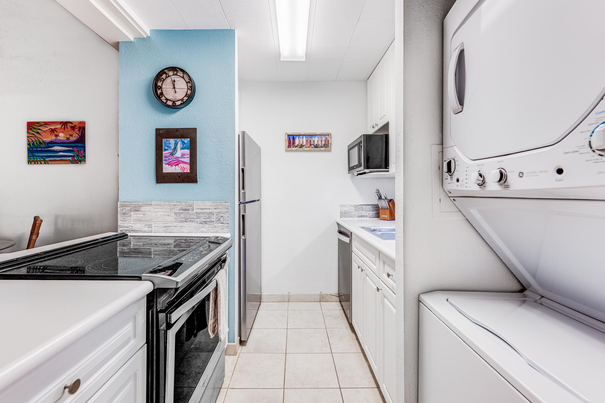 2191 South Kihei Road, Unit 3402 Kihei, HI 96753 - Photo 17 of 50 a kitchen with a stove and a refrigerator