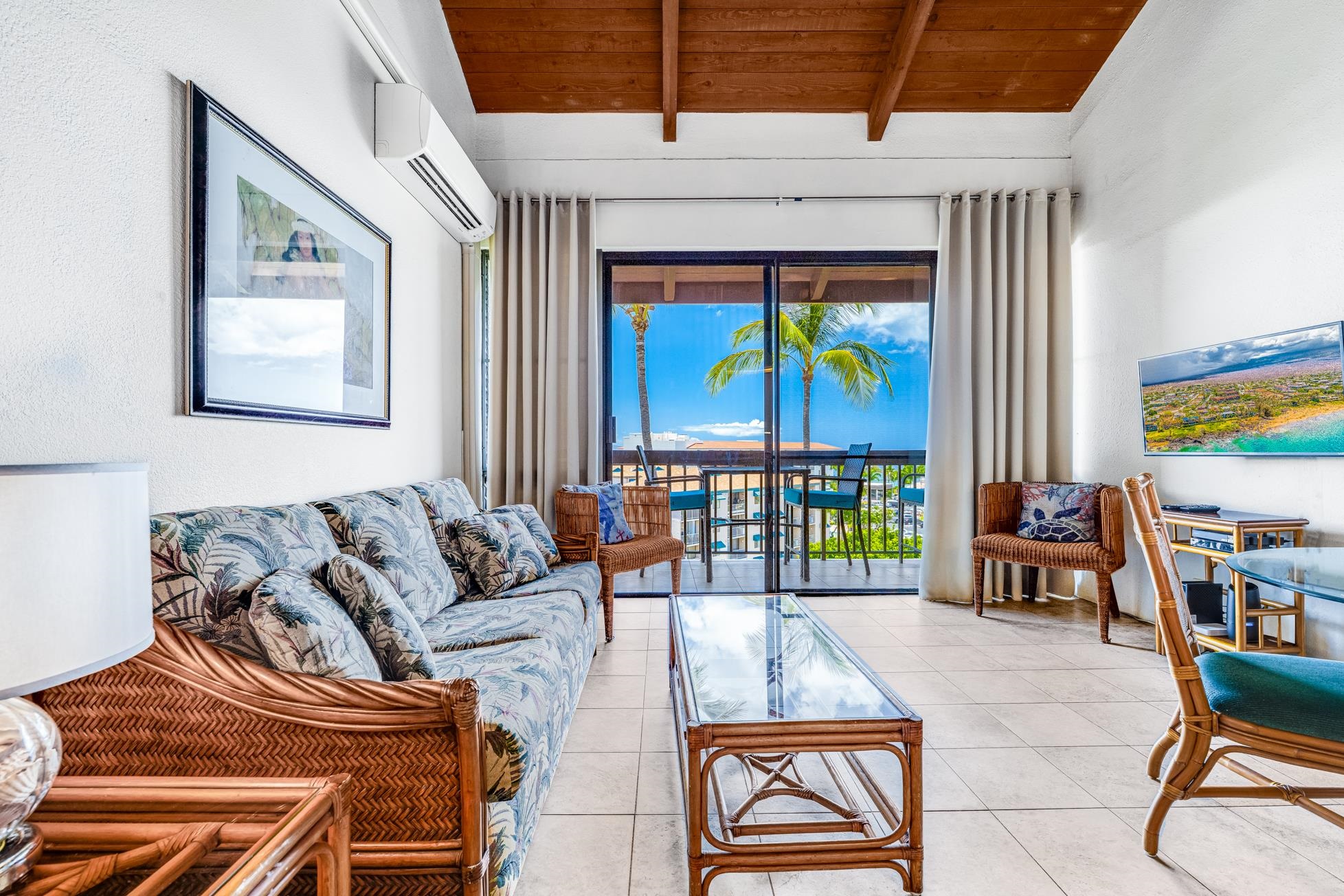 2191 South Kihei Road, Unit 3402 Kihei, HI 96753 - Photo 2 of 50 a living room with furniture and a floor to ceiling window