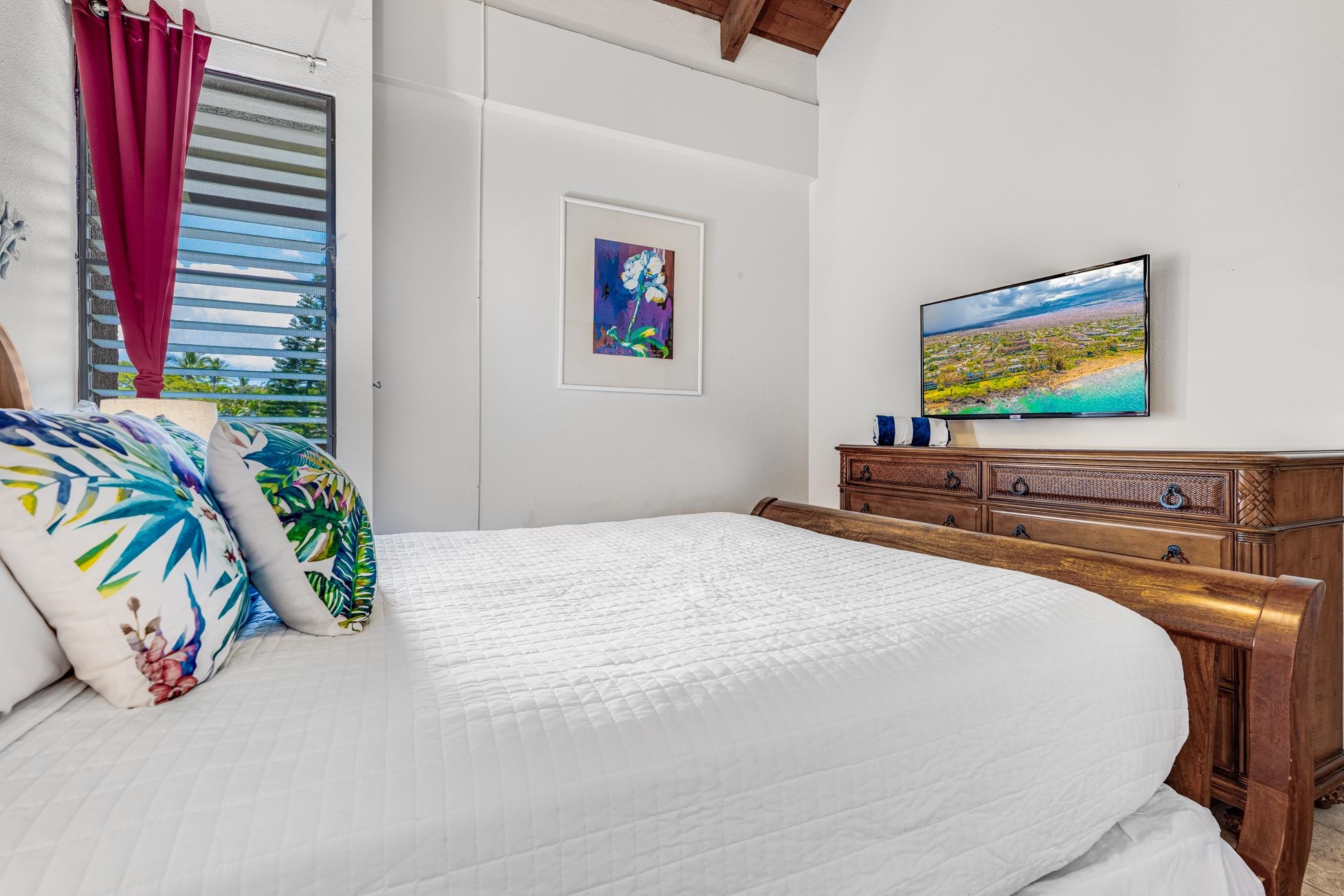 2191 South Kihei Road, Unit 3402 Kihei, HI 96753 - Photo 22 of 50 a bedroom with a bed and a flat screen tv