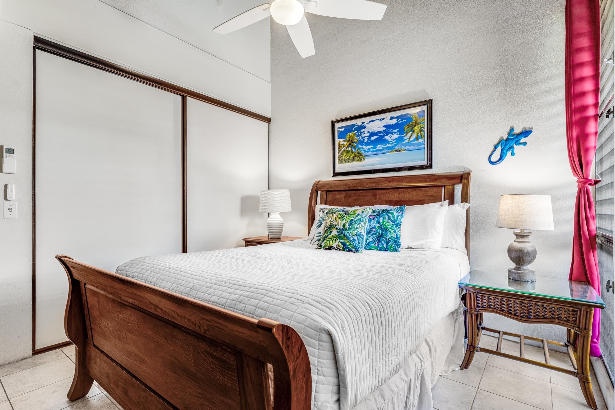 2191 South Kihei Road, Unit 3402 Kihei, HI 96753 - Photo 23 of 50 a bedroom with a bed and a painting on the wall