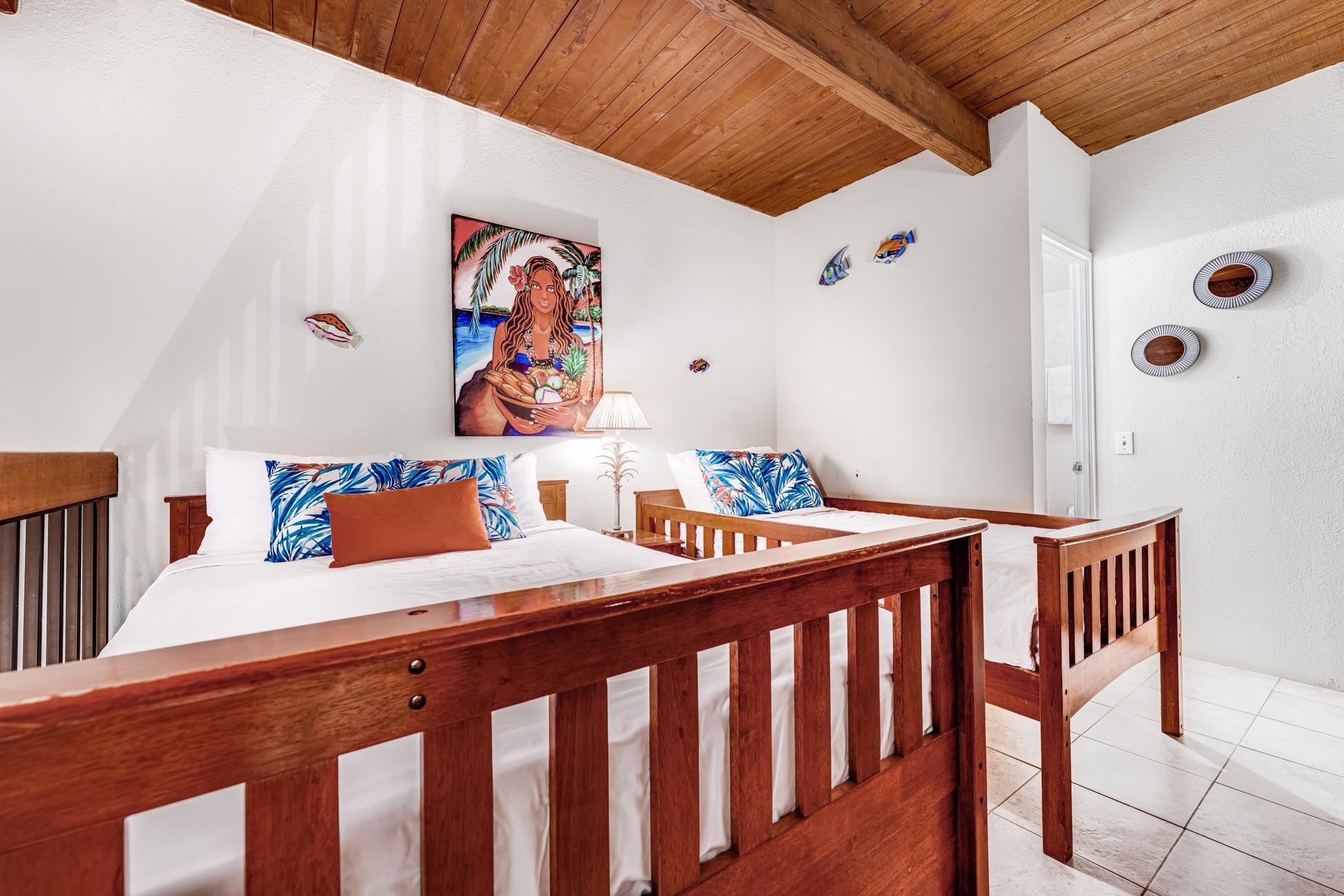 2191 South Kihei Road, Unit 3402 Kihei, HI 96753 - Photo 28 of 50 a bedroom with furniture and wooden floor